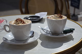 Two Viennese coffees served on a terrace.