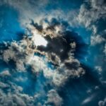 A sky with dark clouds pierced by rays of sunshine. Credits : dimitrisvetsikas1969, pixabay.